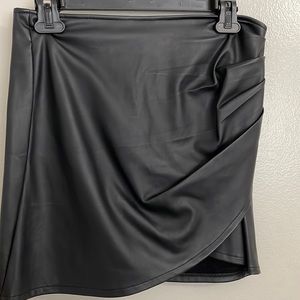 Black, faux leather mini skirt, size medium